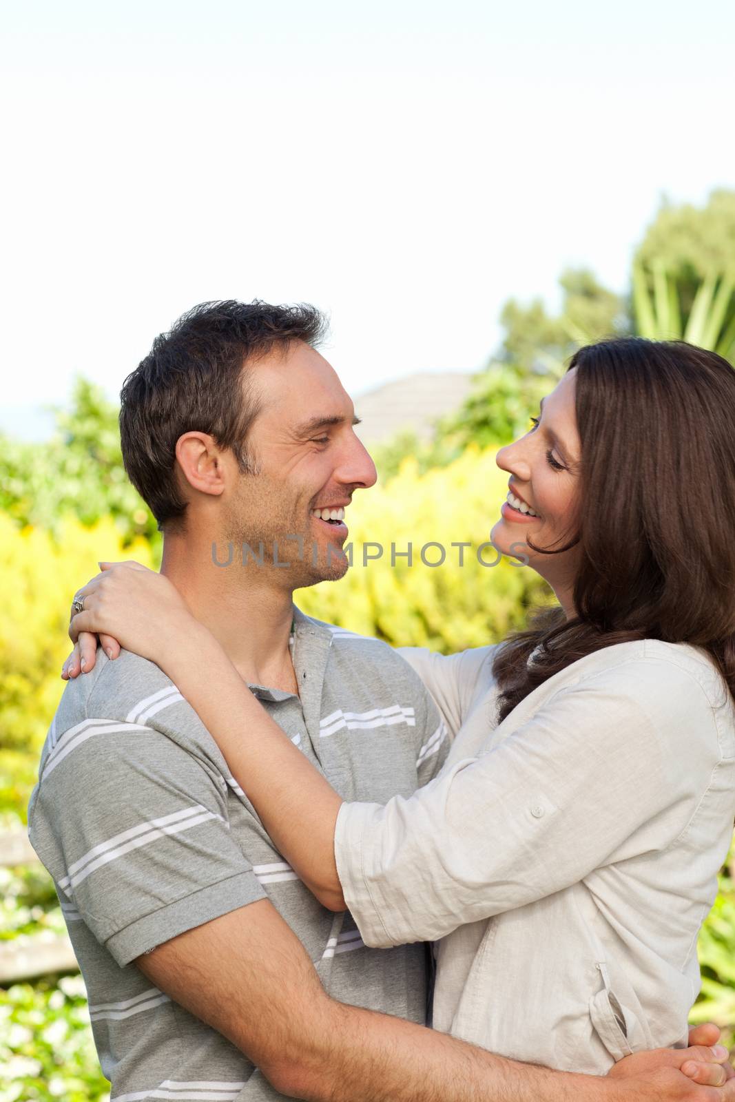 Enamored couple in the garden by Wavebreakmedia