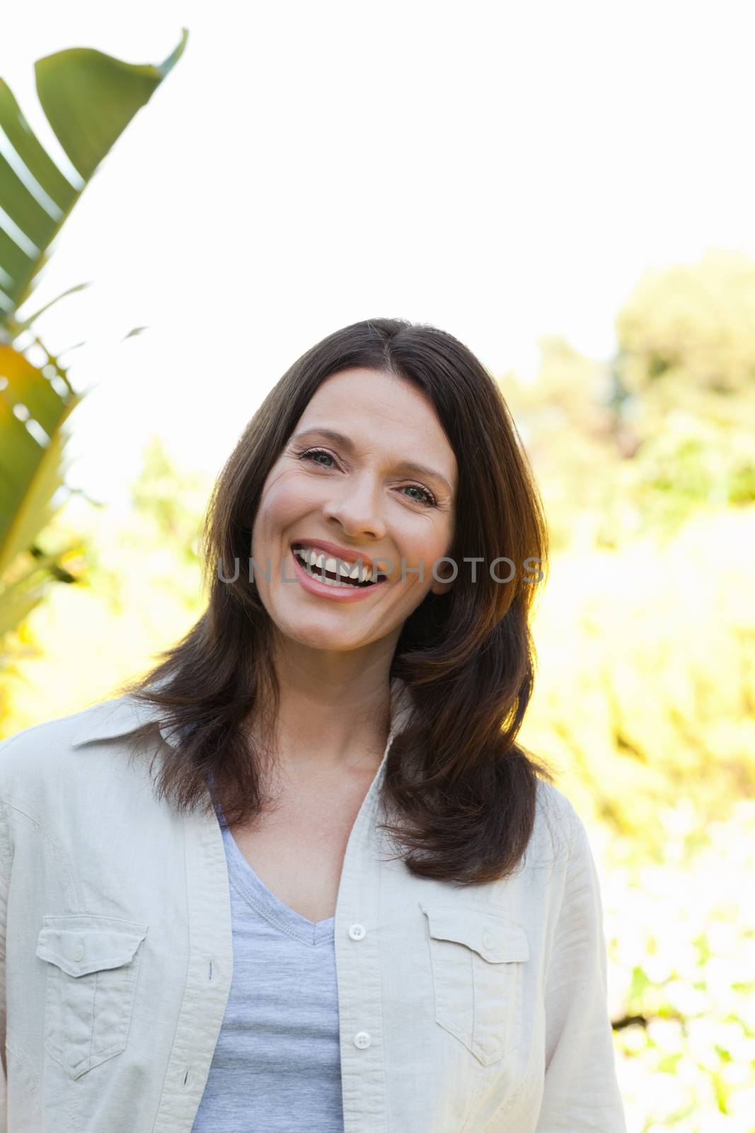 Portrait of a beautiful woman in the garden by Wavebreakmedia