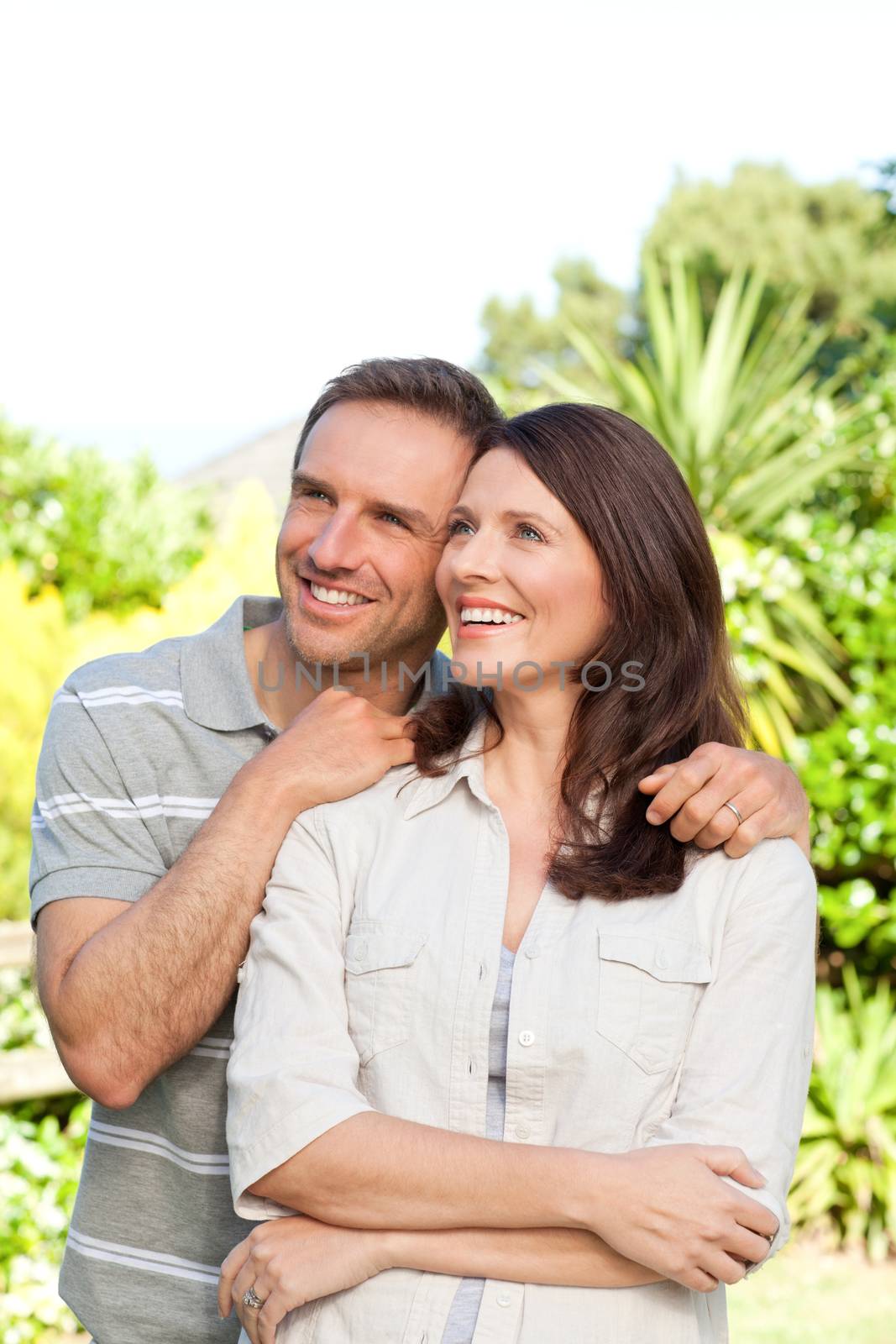 Beautiful woman with her husband in the garden