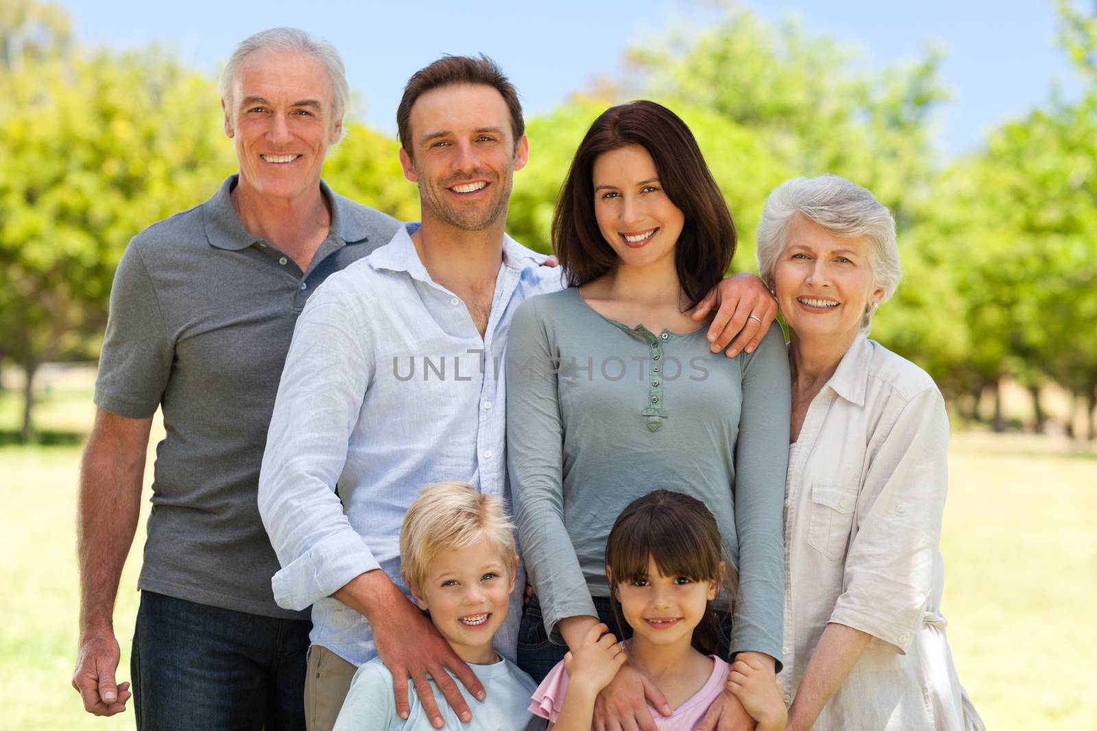 Family standing in the park