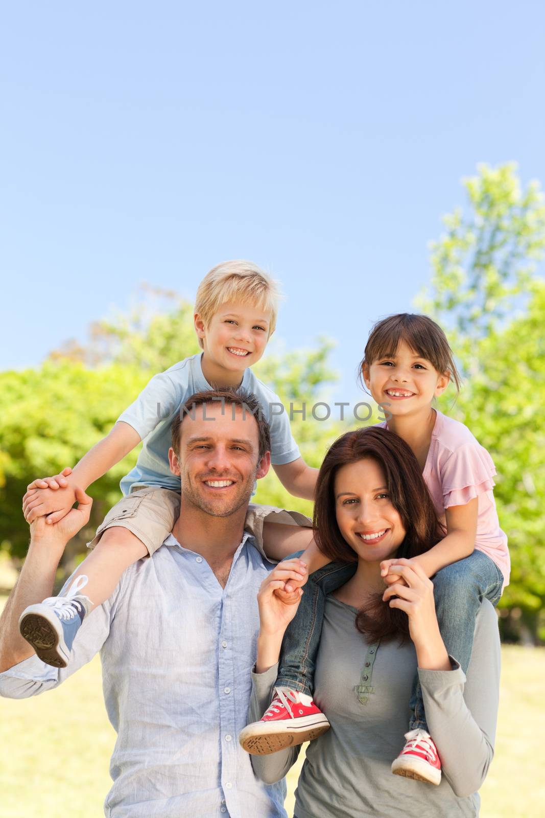 Family standing in the park