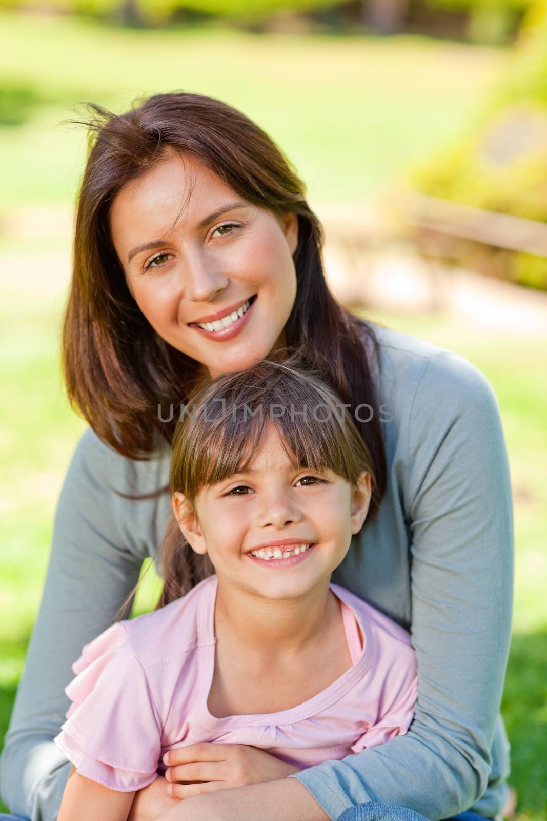 Happy mother with her daughter in the park