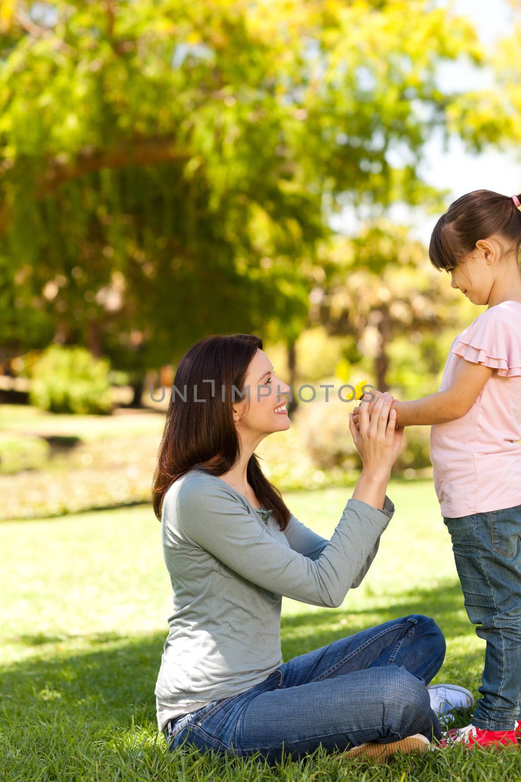 Beautiful mother with her daughter in the park