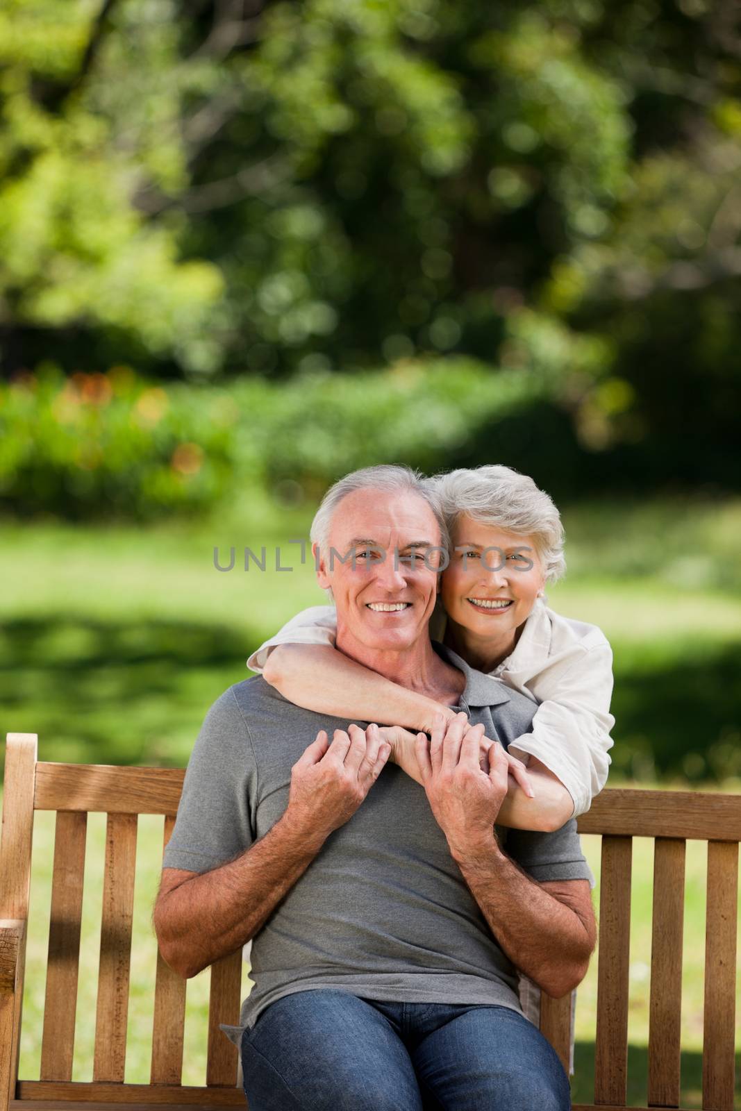 Mature couple hugging in the garden