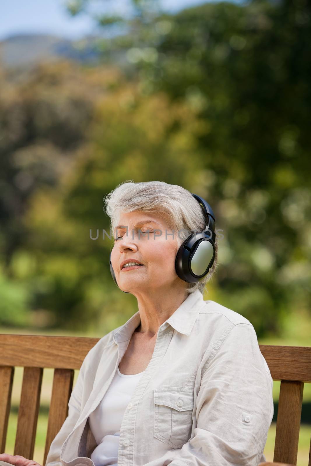 Elderly woman listening to some music