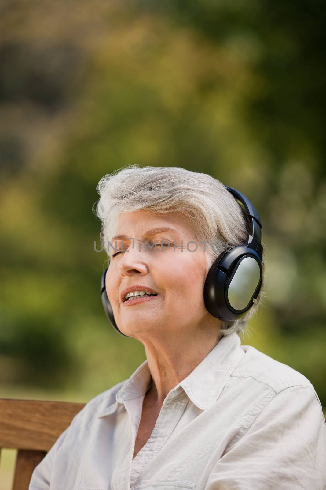 Elderly woman listening to some music