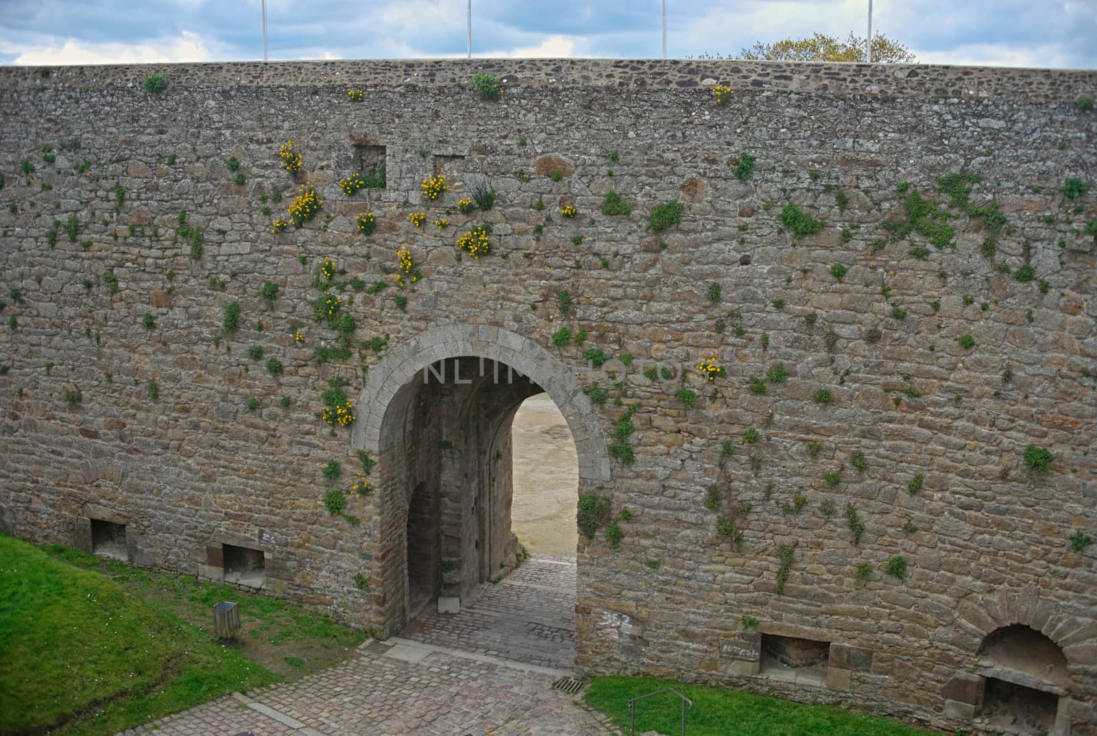 Big stone walls and gate at Dinan fortress, France