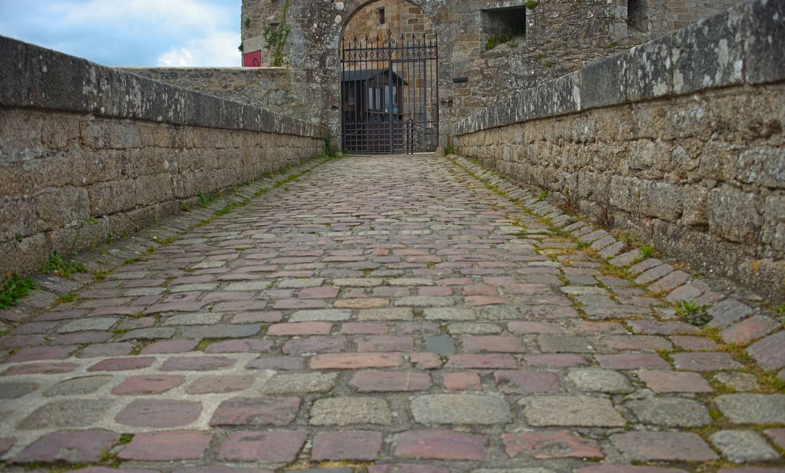 Stone pathway and gate into a fortress at Dinan, France by sheriffkule