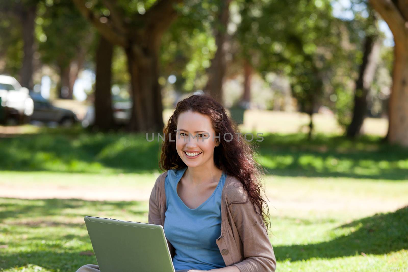 Woman working on her laptop by Wavebreakmedia