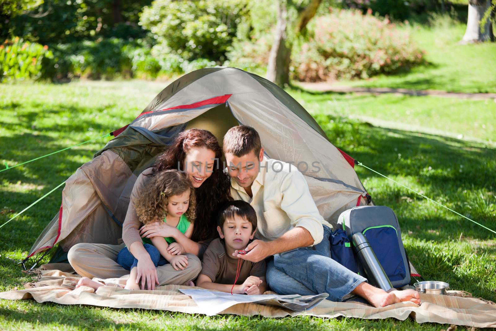 Joyful family camping by Wavebreakmedia