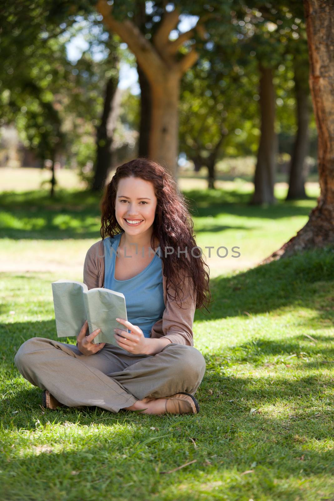 Woman reading a book in the garden
