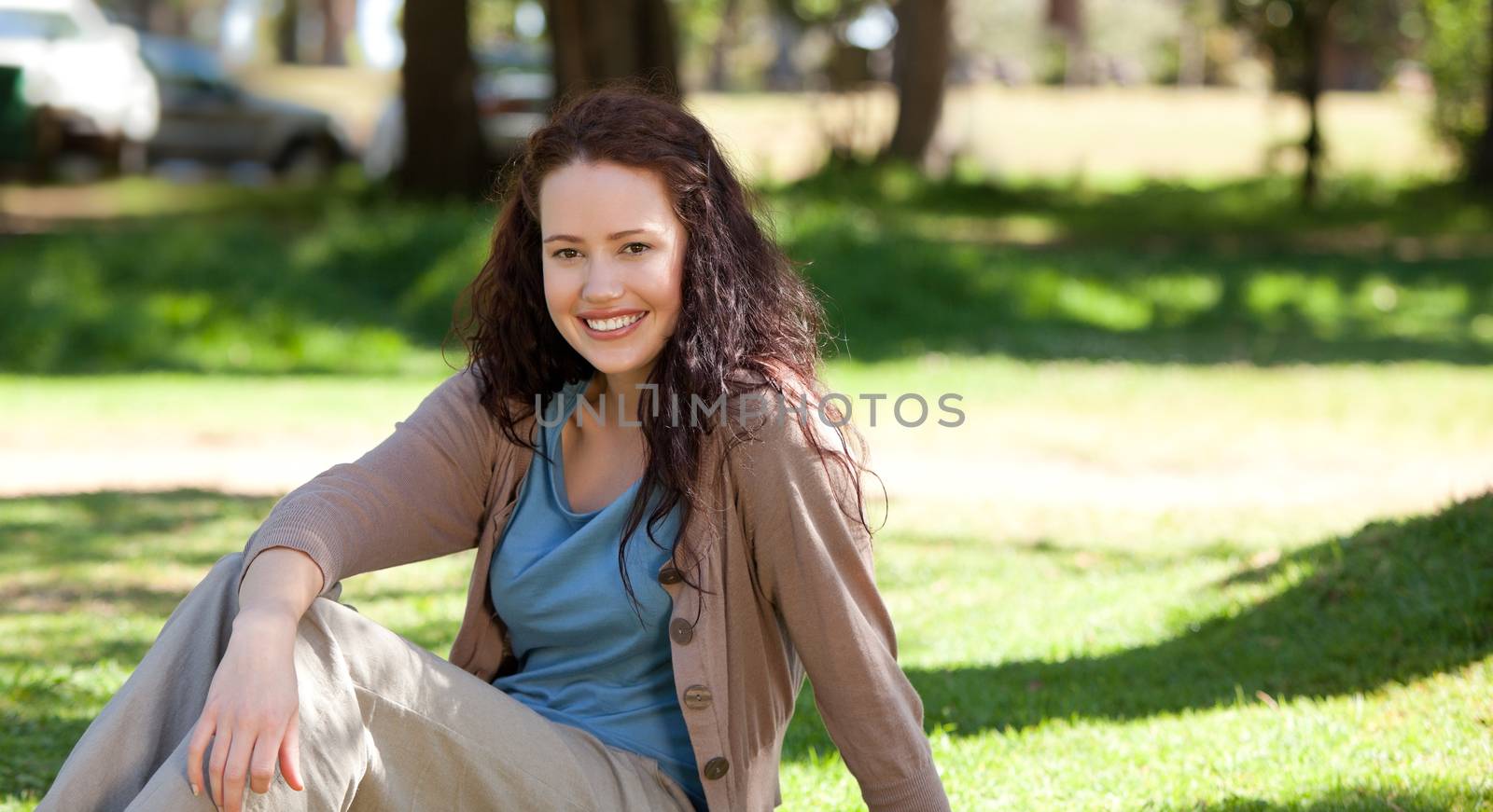 Beautiful woman sitting in the garden