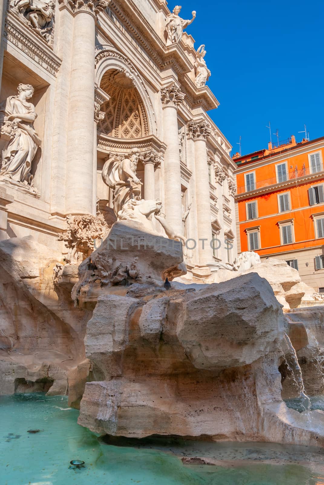 Trevi Fountain, Rome, Italy. Trevi Fountain is one of the main tourist attractions in the city. Beautiful view of Trevi Fontana in summer. Ornate baroque architecture of Trevi, nice Roma landmark.