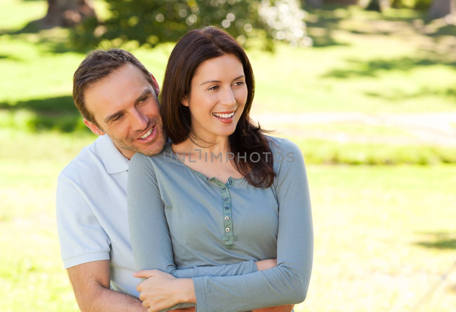 Beautiful couple hugging in the park