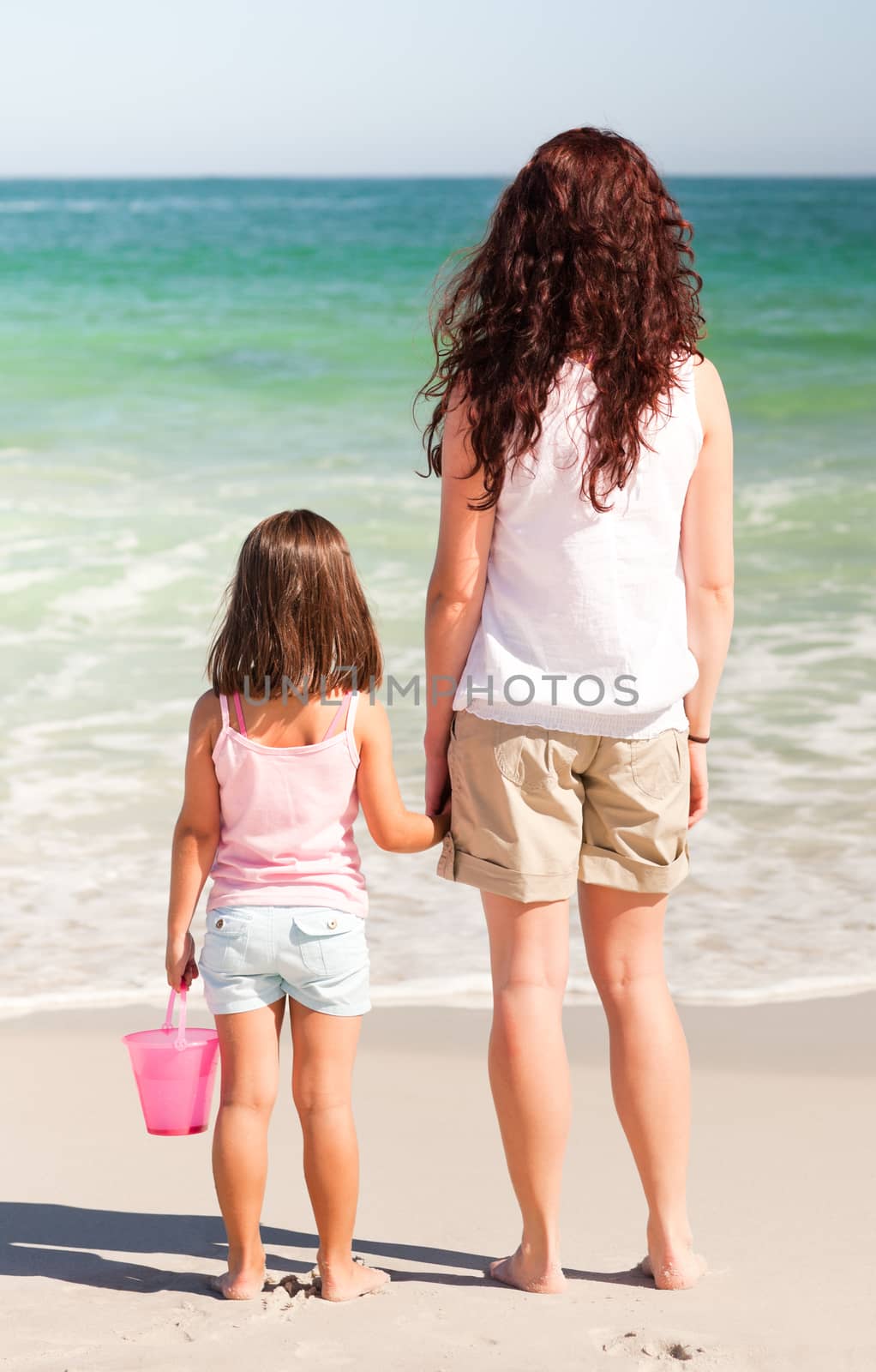 Mother and her daughter on the beach by Wavebreakmedia