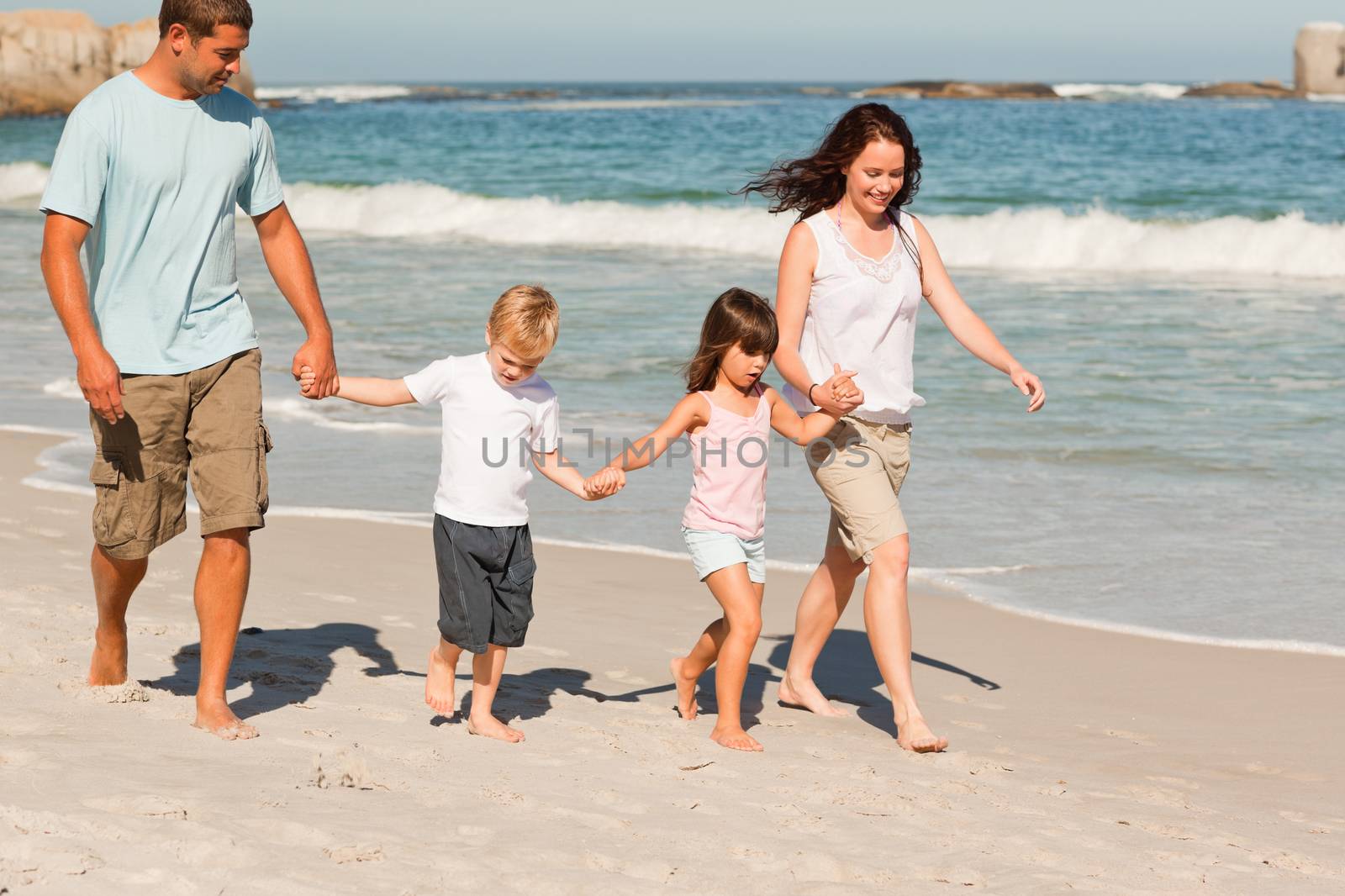 Family walking on the beach