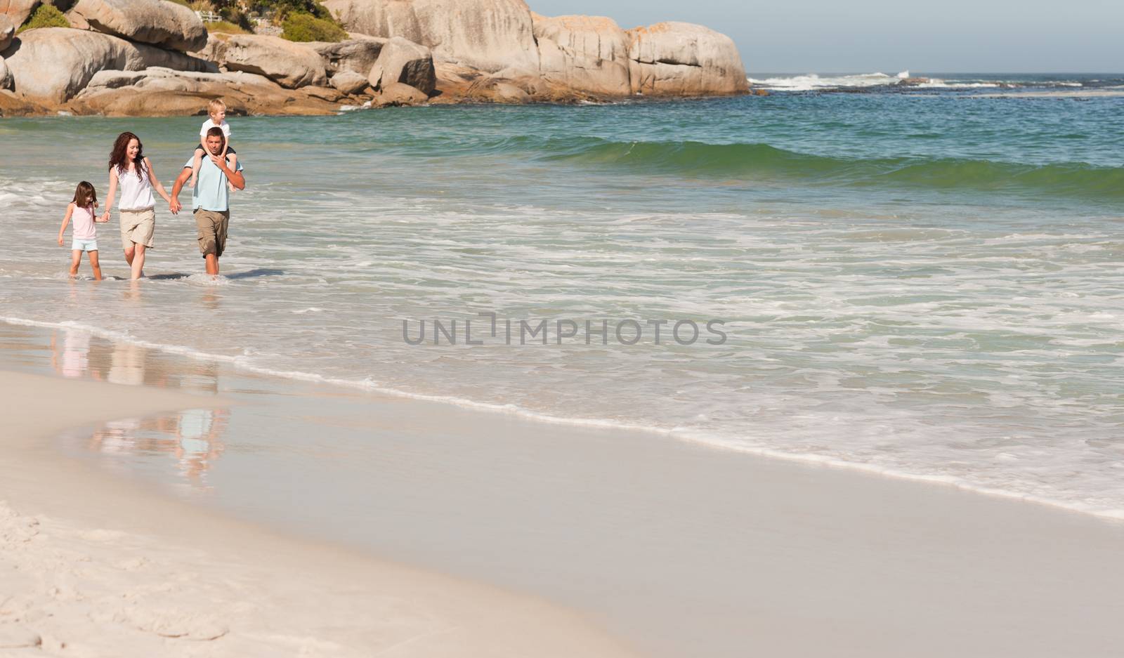 Joyful family at the beach