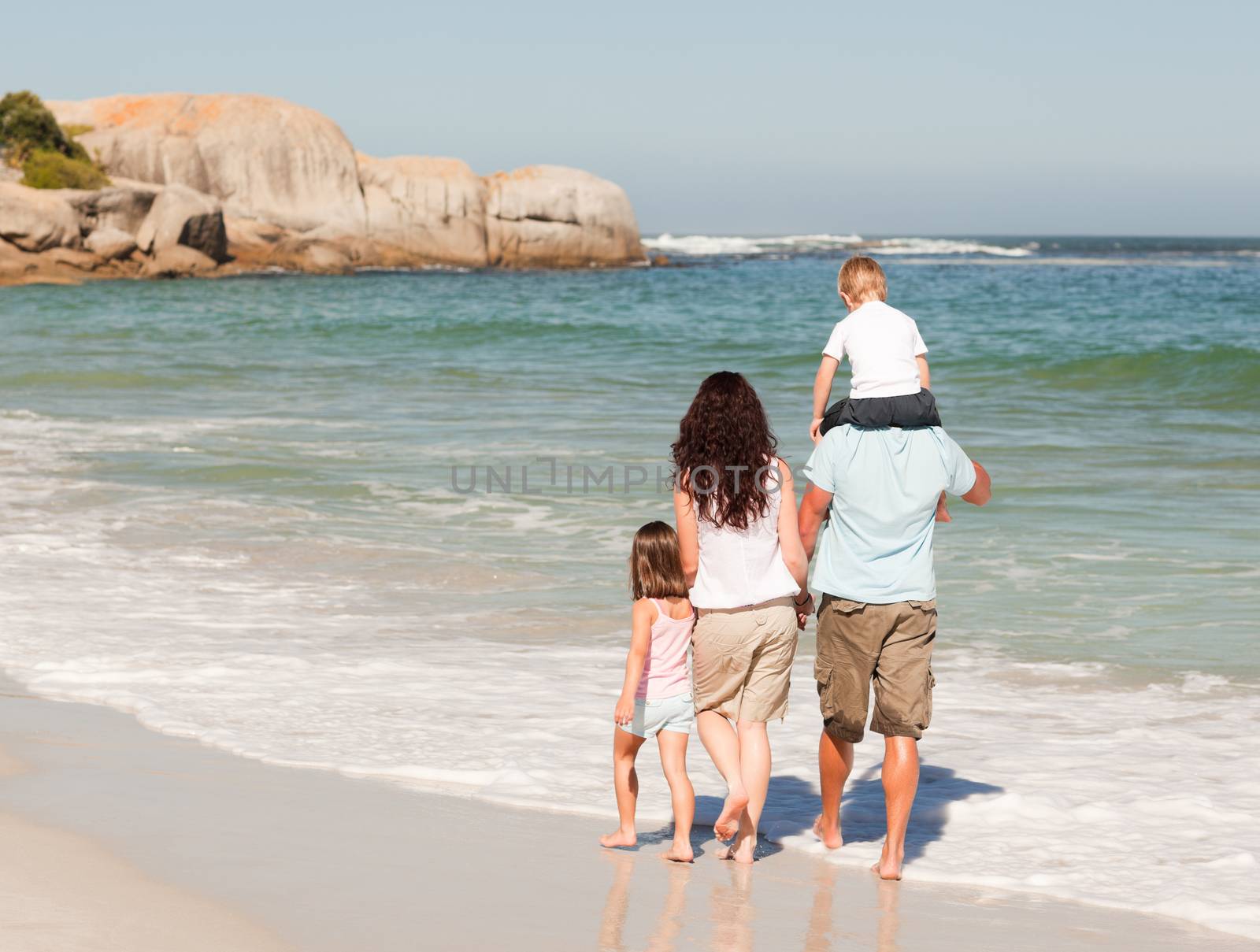 Joyful family at the beach