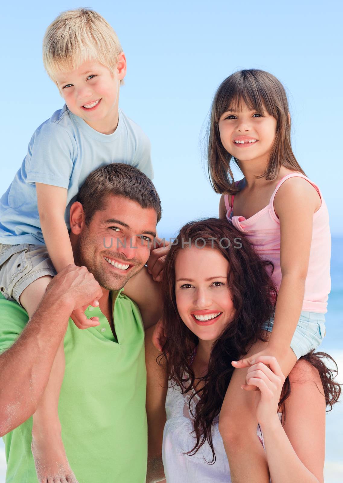 Happy children playing with their parents by Wavebreakmedia