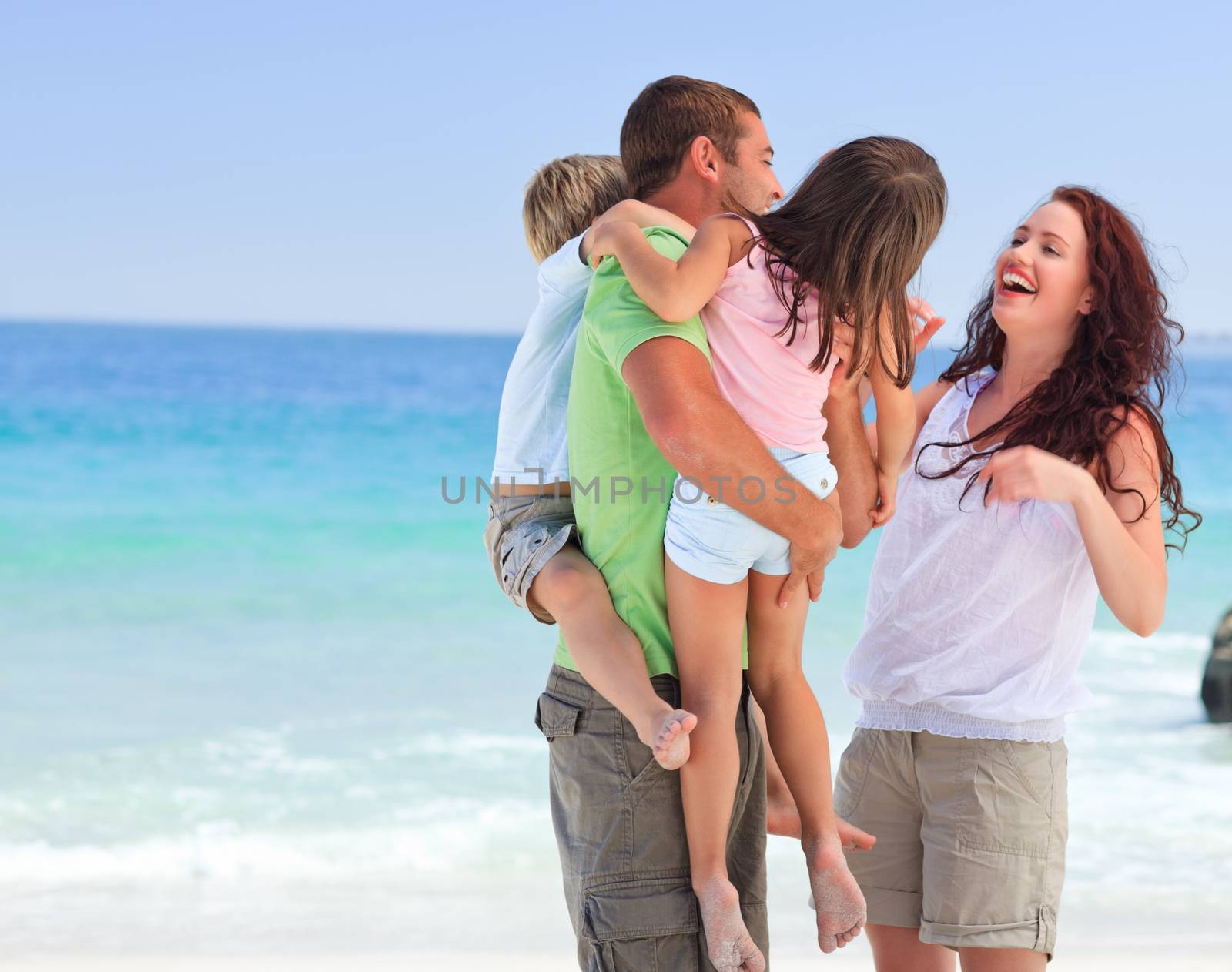 Happy children playing with their parents