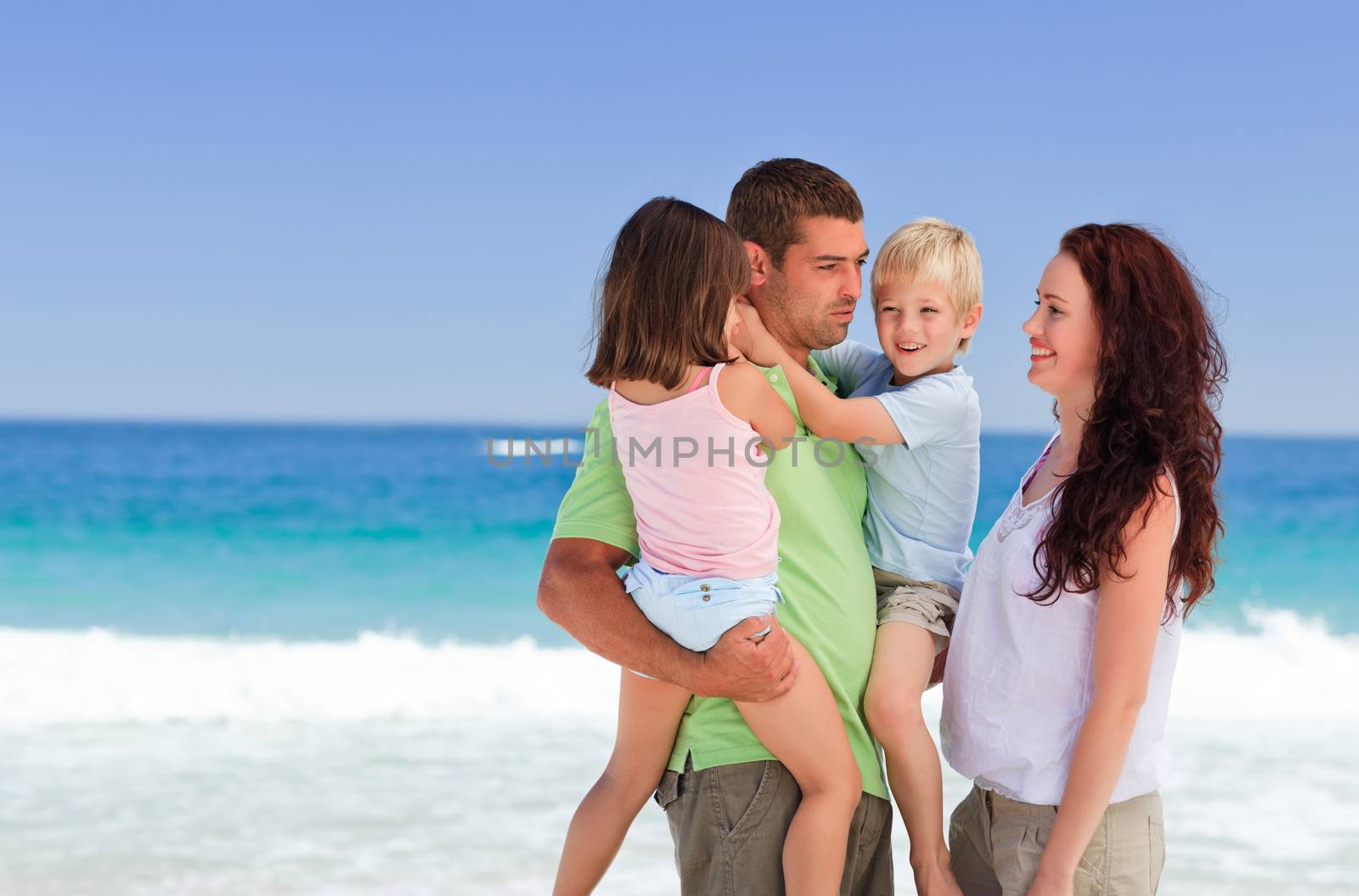 Happy children playing with their parents