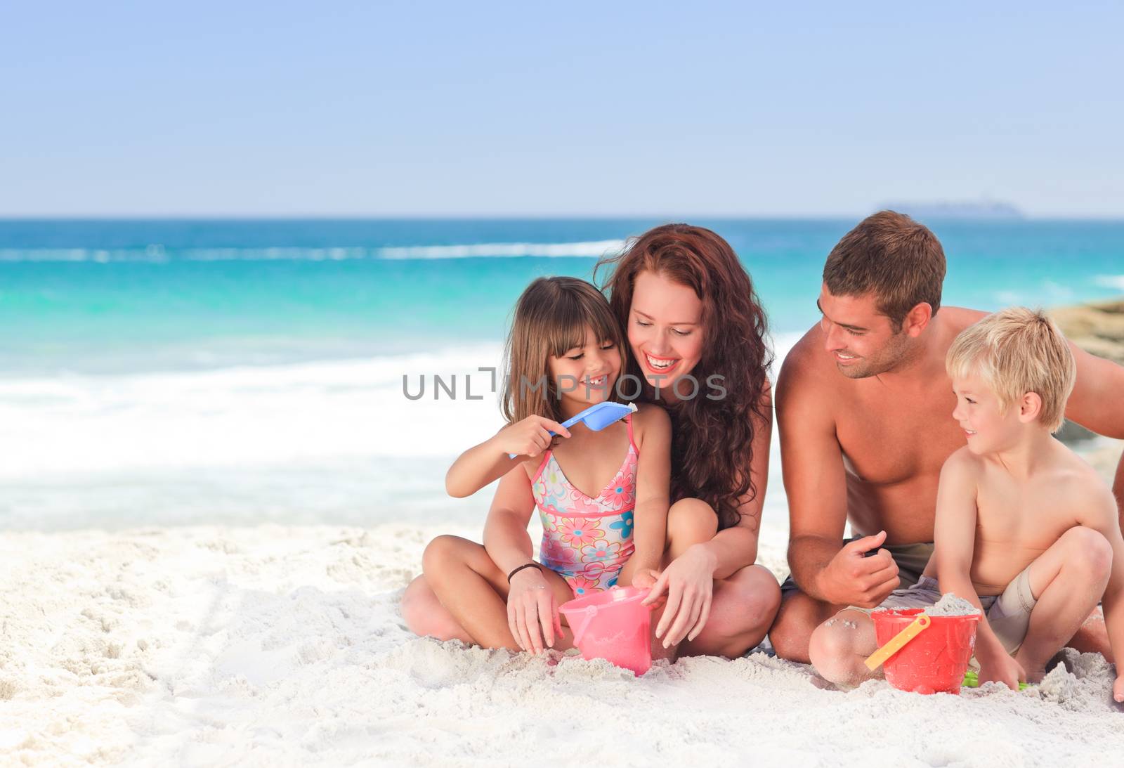 Portrait of a family at the beach by Wavebreakmedia