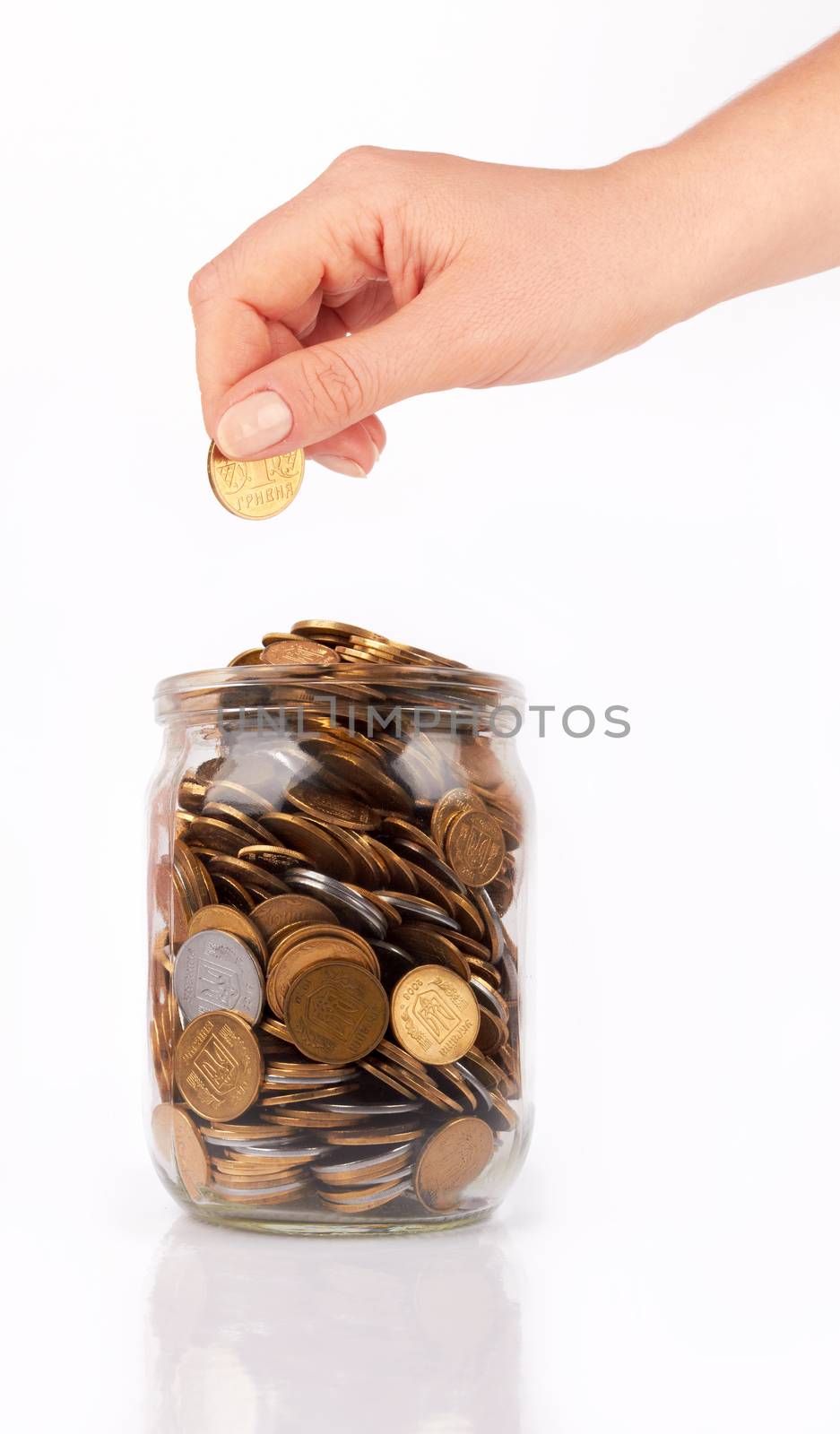 hand put coin jar with coins isolated on white 