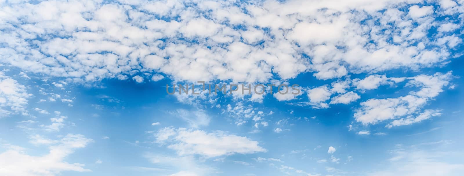 Dramatic blue sky with scenic clouds texture with copy space, may be used as background