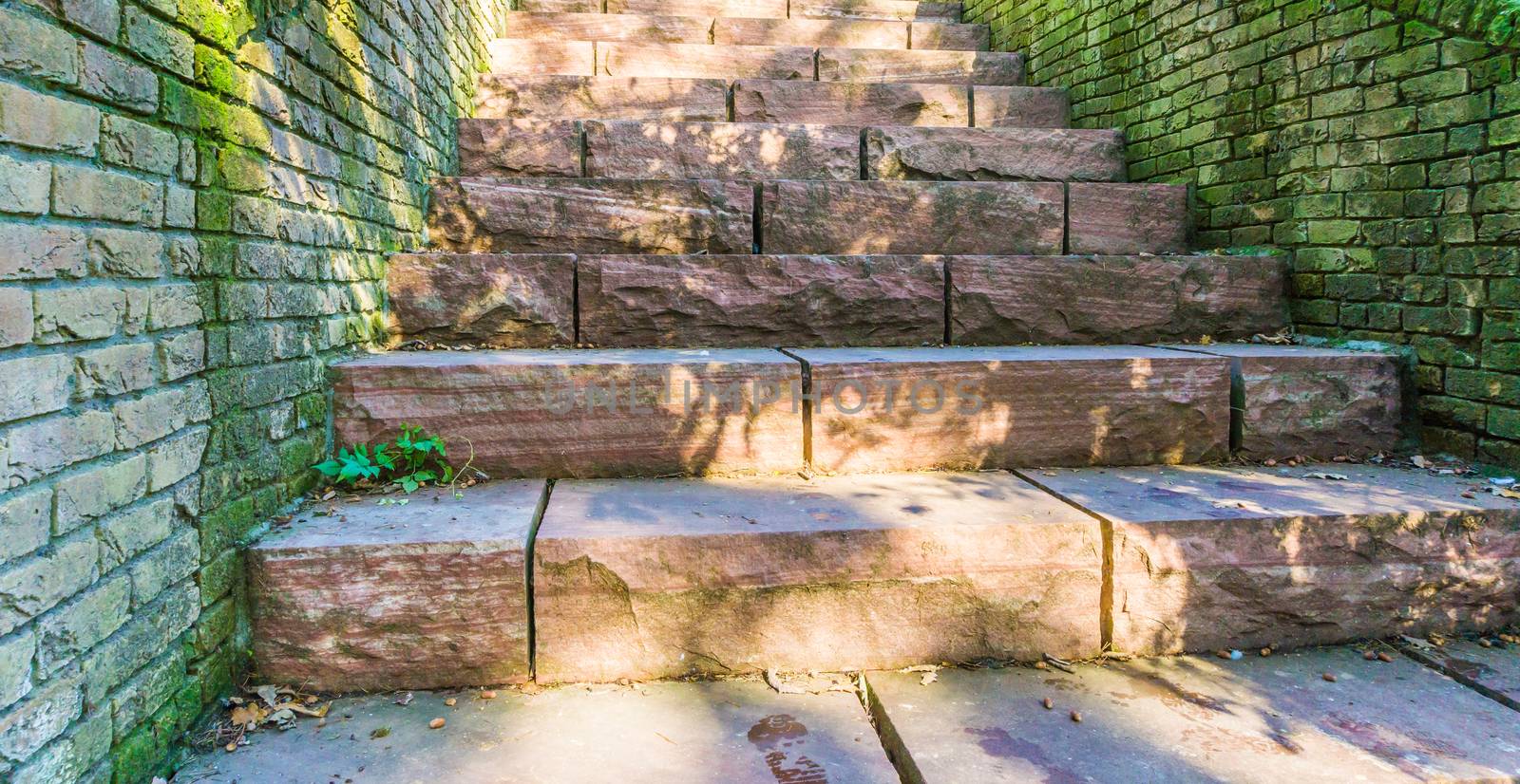 long red stone staircase steps made out of big granite stone blocks old retro style background texture