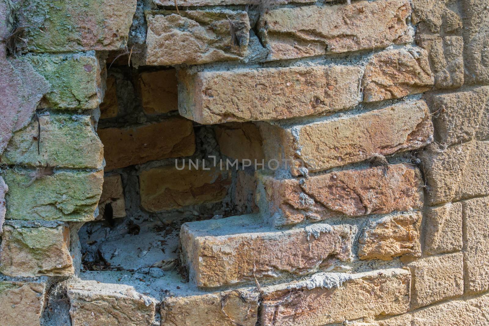 Red brick wall with a open hole in it background texture