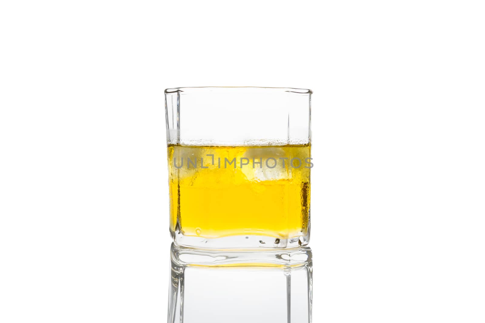Glass of whisky on white background