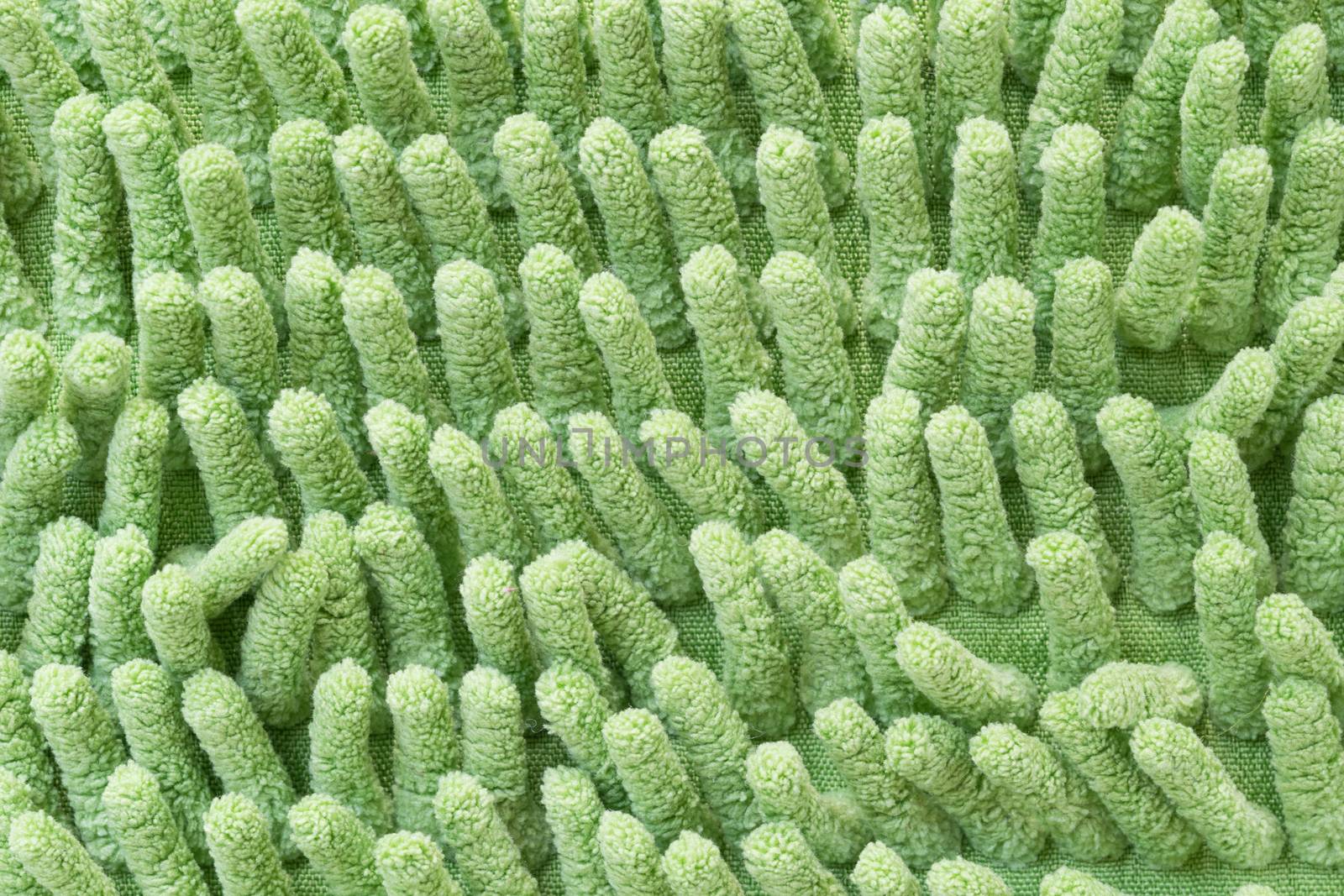 Macro green cleaning doormat or carpet