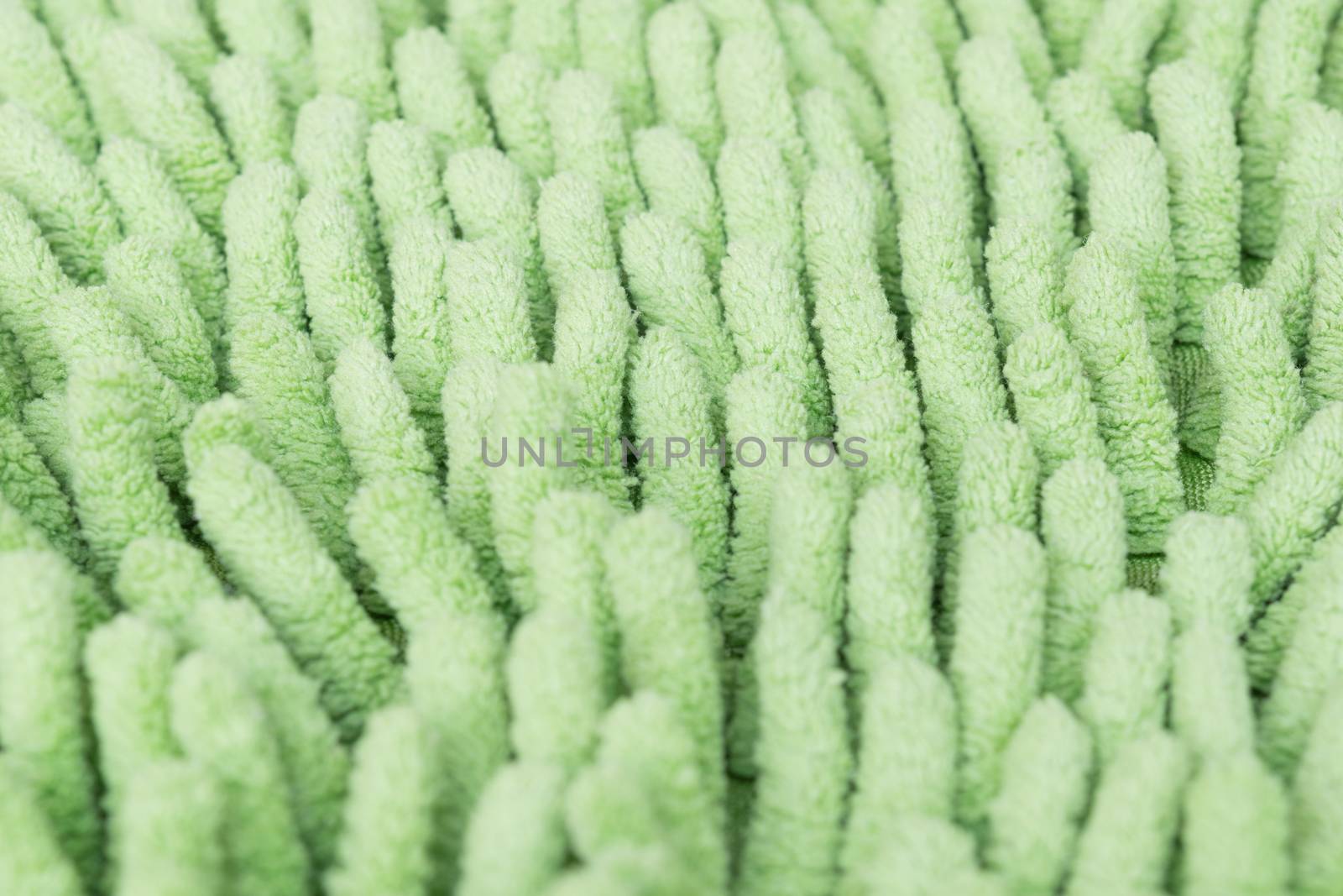 Macro green cleaning doormat or carpet for background