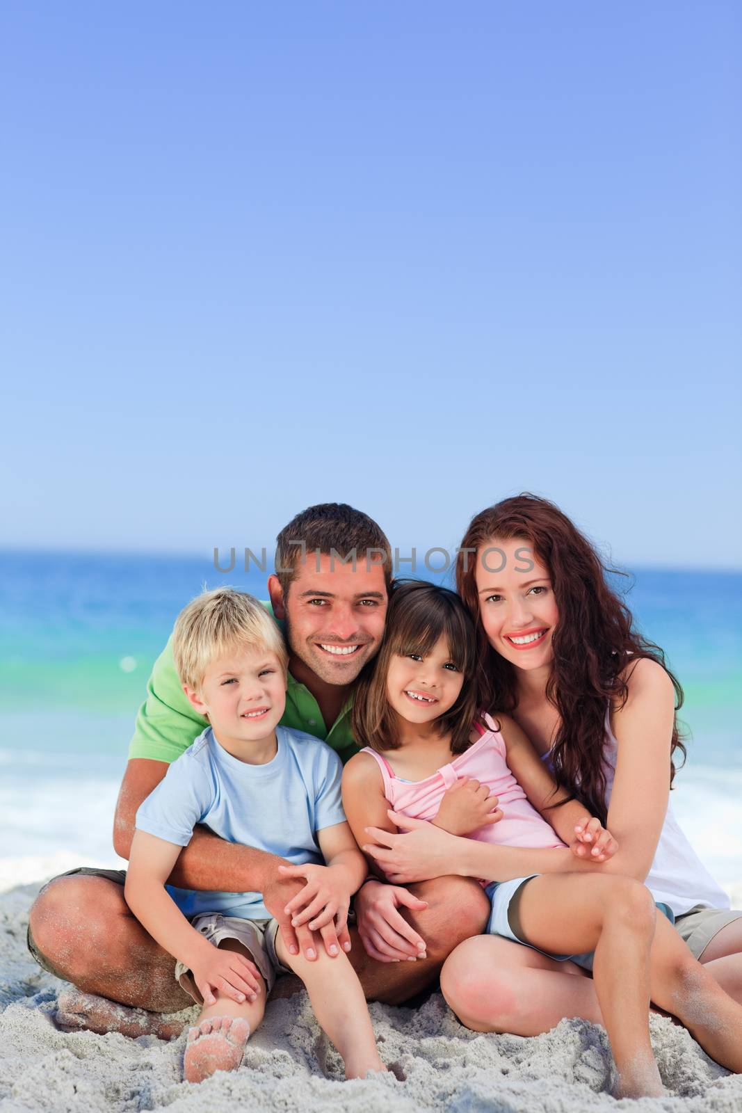 Portrait of a family at the beach by Wavebreakmedia