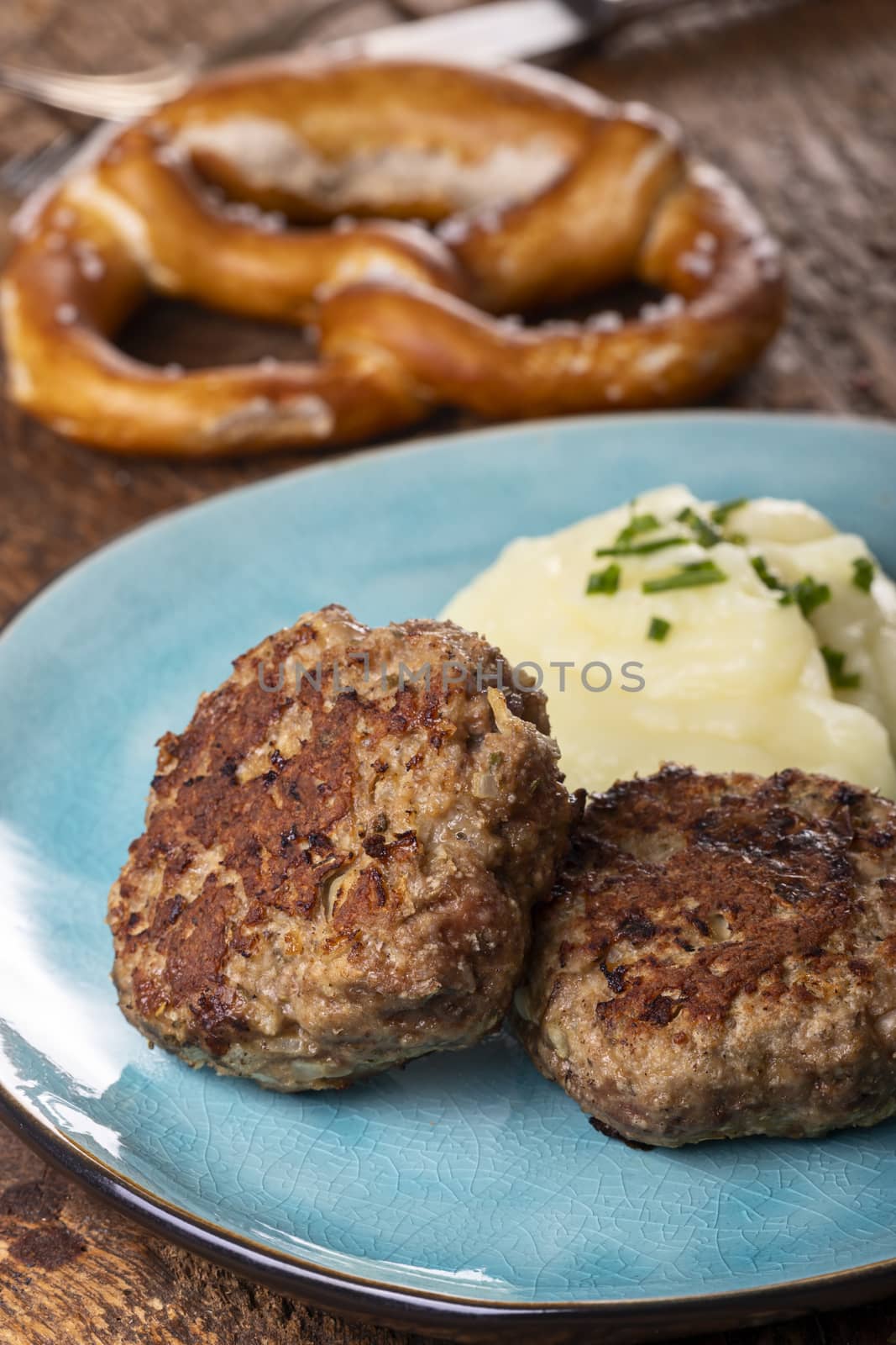 two bavarian meat loafs on a plate by bernjuer