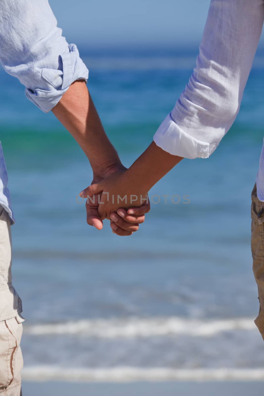 Enamored couple looking at the sea by Wavebreakmedia