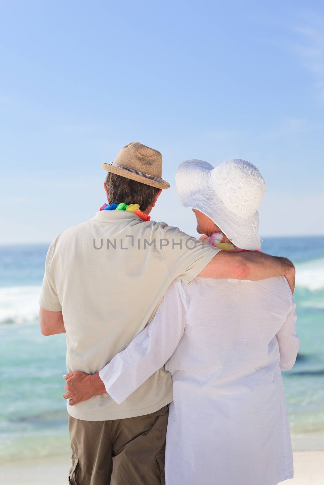 Enamored couple looking at the sea by Wavebreakmedia