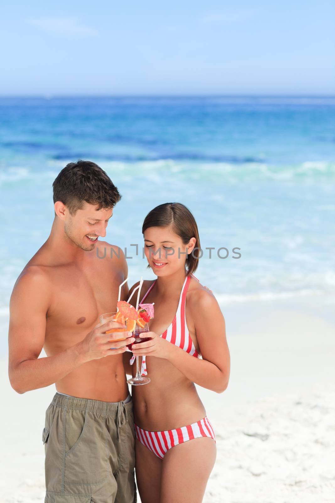 Adorable couple drinking a cocktail