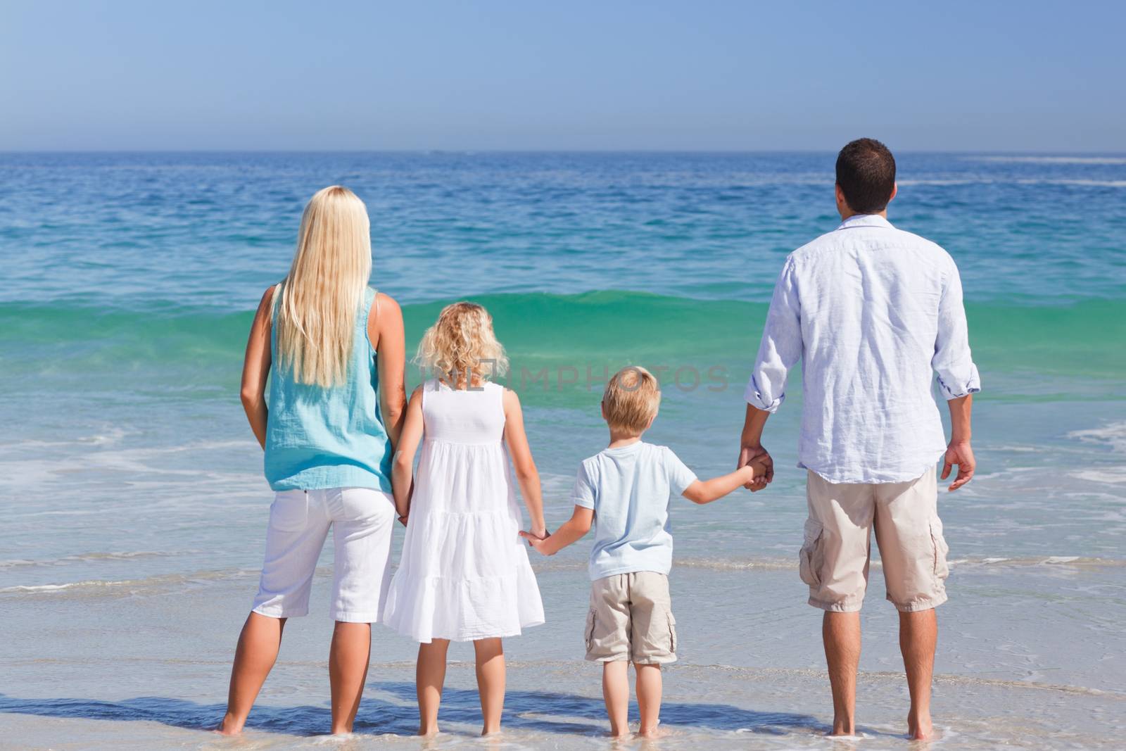 Portrait of a family on the beach by Wavebreakmedia