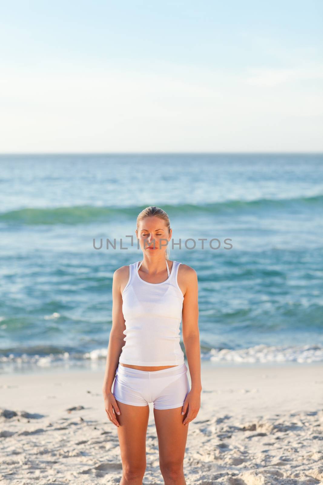 Woman practicing yoga  by Wavebreakmedia