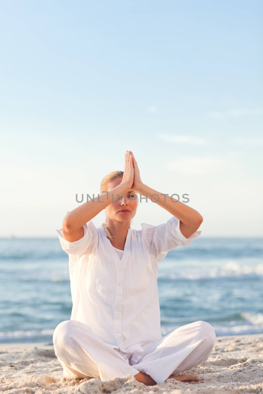 Active woman practicing yoga  by Wavebreakmedia