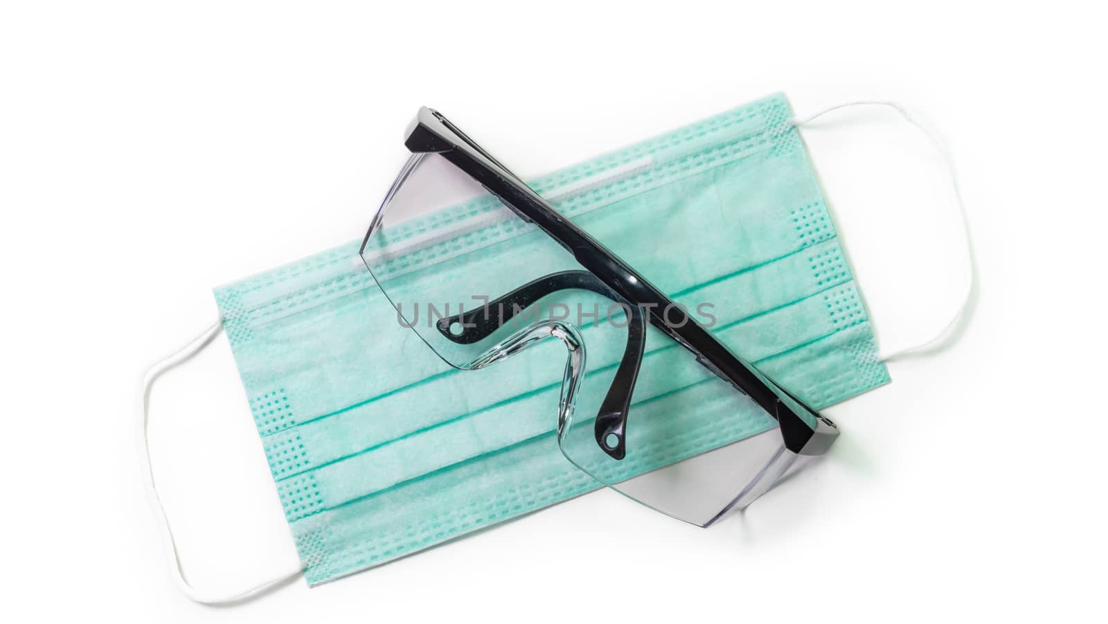 The close up of Anti-viral protection mask and Eye protection glasses on white background.