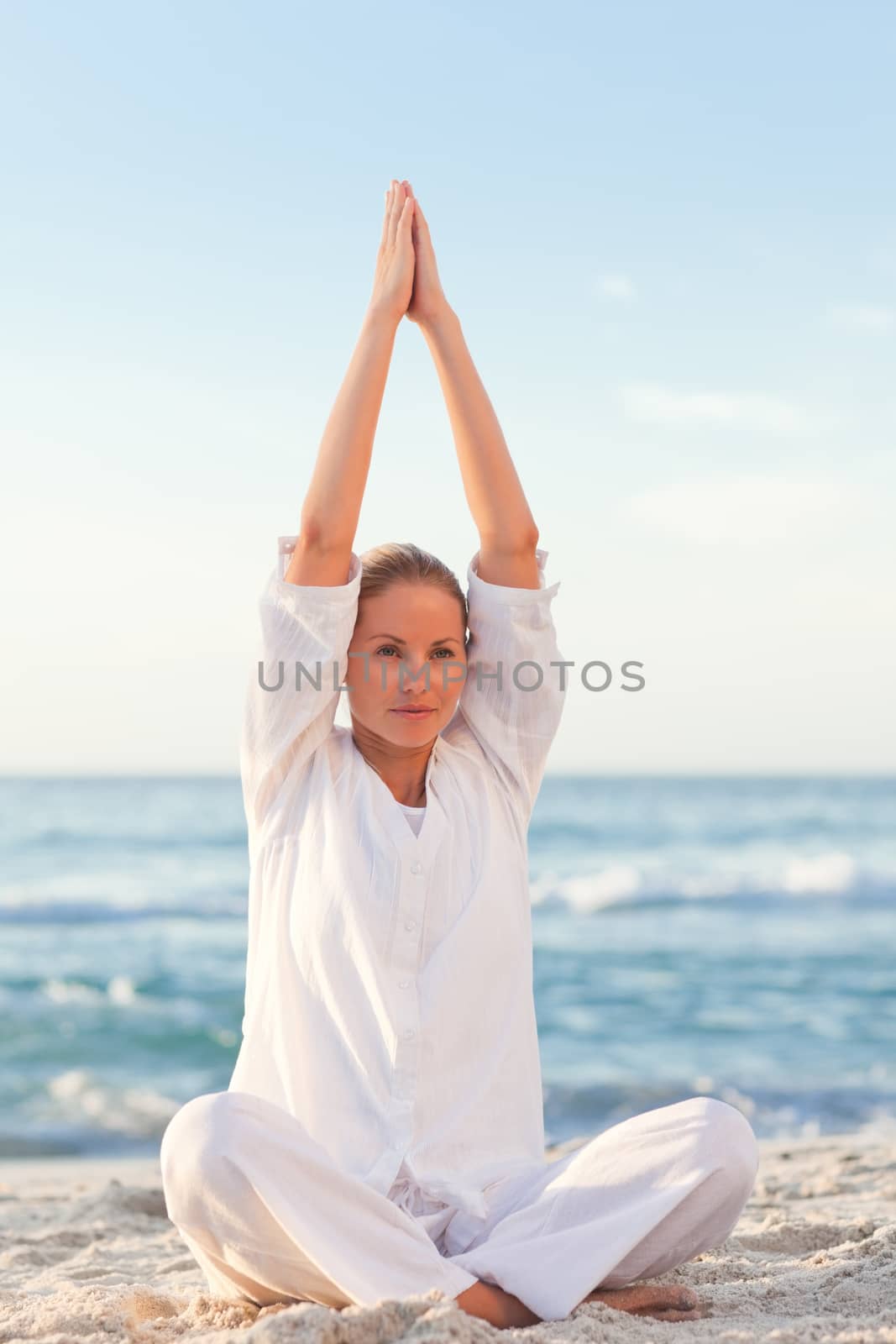 Peaceful woman practicing yoga  by Wavebreakmedia