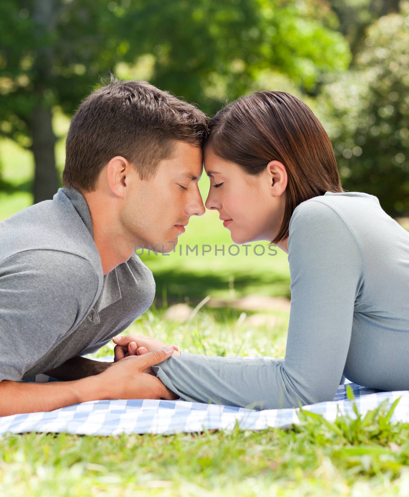 Enamored couple in the park  by Wavebreakmedia