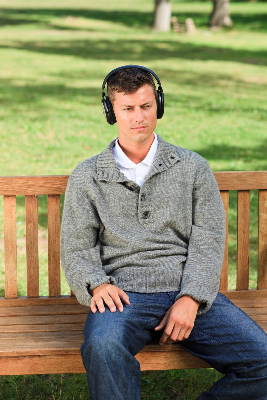 Relaxed man listening to some music during the summer