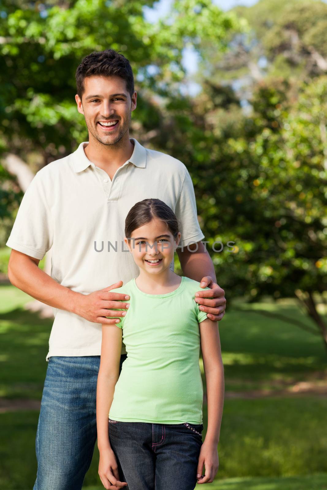 Daughter with her father in the park during the summer