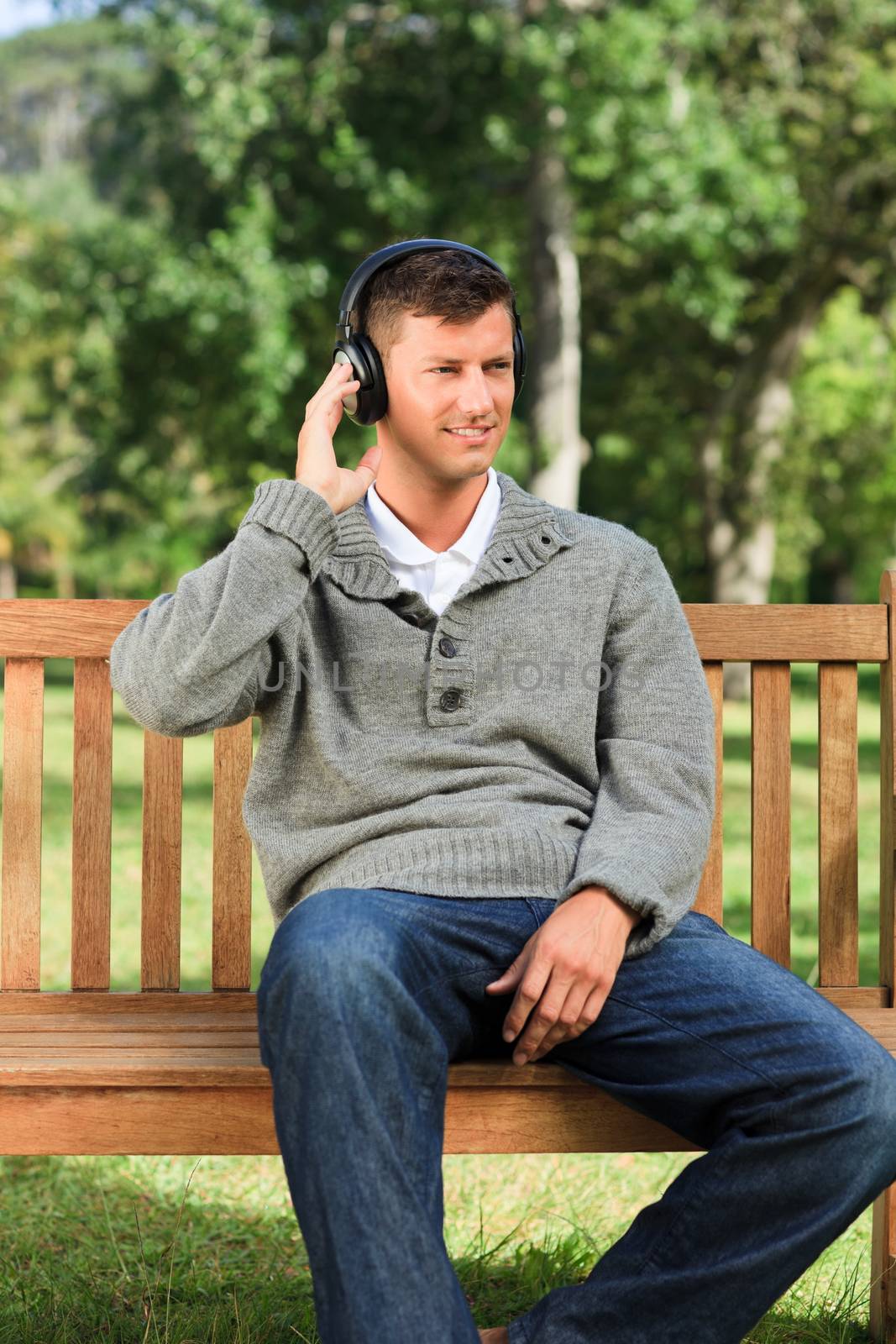 Relaxed man listening to some music during the summer