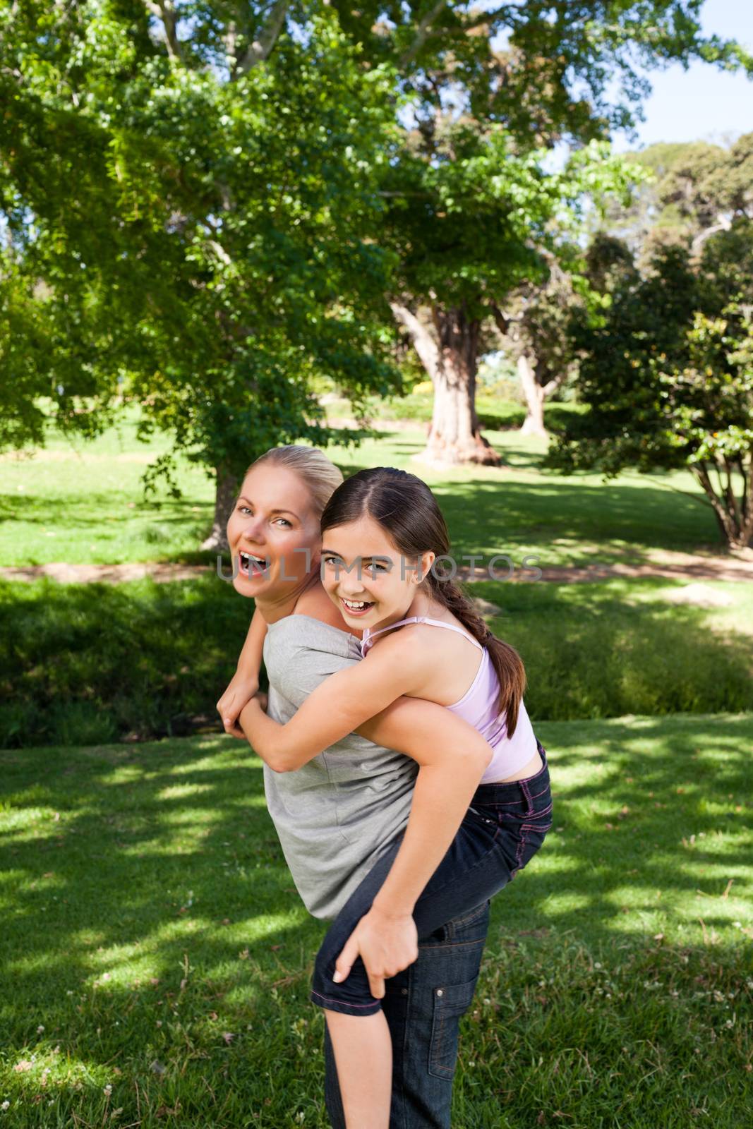 Daughter playing with her young mother by Wavebreakmedia