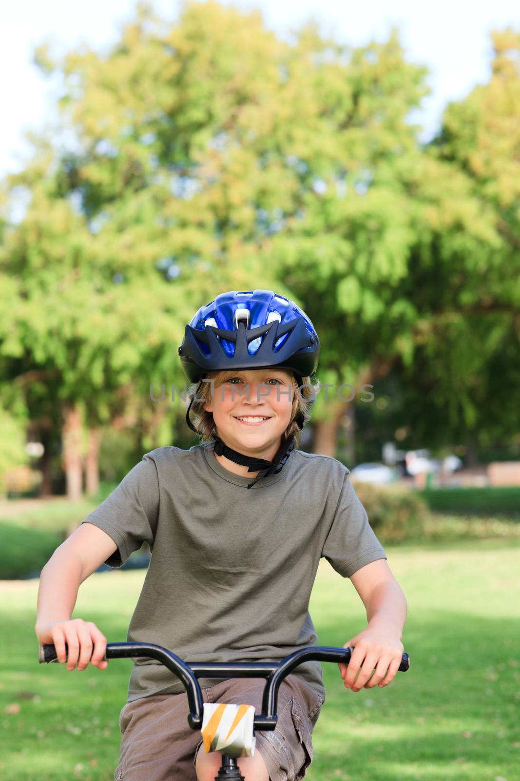 Little boy with his bike during the summer