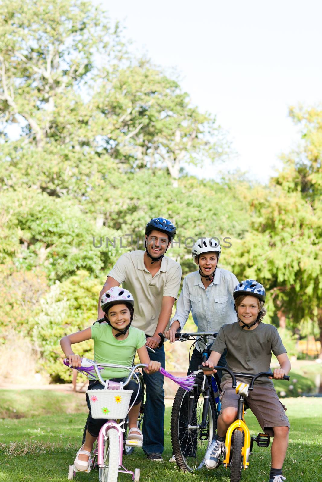 Family with their bikes during the summer by Wavebreakmedia